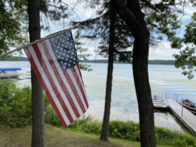 American flag on the lake shore